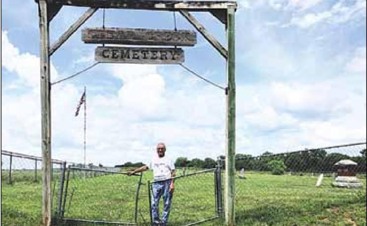 Shad Gager at the Clear Creek Cemetery entrance Sharla Sitzman Photo