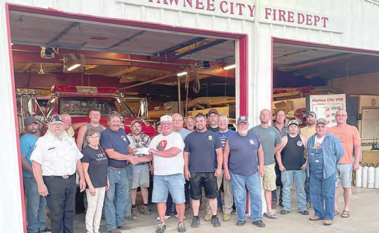 The VFW and Auxiliary presented a check for $2,025 to the Pawnee City Fire Department Tuesday night. The check was the amount raised from the recent fundraiser held at the Blazin’ Bull. The money will go toward the new fire station. Ray Kappel/Republican