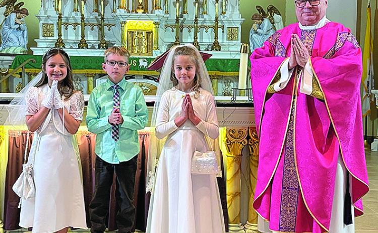St. Anthonys - Oakley Antholz, Brantly Thiemann, Hazel Tyler and Father Christensen.