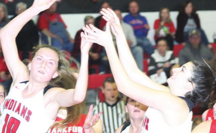P.C.’s Neveah Blecha (right) puts up a shot as teammates Emily Lytle (#10 and Cameron Ottersberg (#25) look on. Blecha scored 4 points against Frankfort. Paula Jasa/Republican