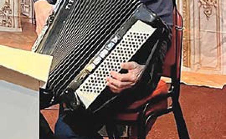 Jim Masty of Dwight plays accordion.