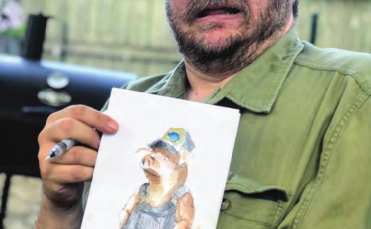 Carmen Cerra shows one of his speed sketches. His free sketches for VIPs will be water color like this.