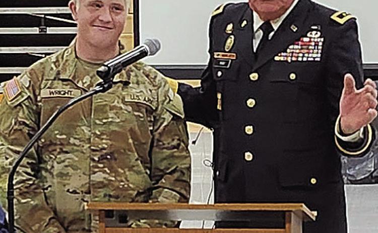 Brody Wright (left) received recognition from Jim Barr (right) at his school's Veterans' Day ceremony last fall