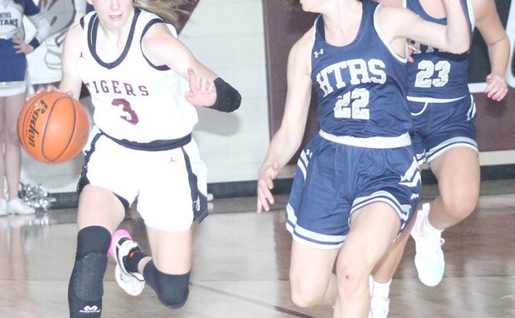 Lewiston’s Katelyn Sanders (#3, left) brings the ball down the court against HTRS’ Lillian Bowen (#22, right) in last Tuesday night’s game. Sanders scored her 1,000th career point at Lewiston and amassed 32 total points in LHS’ 64-31 victory over HTRS. Paula Jasa/Republican