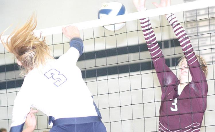 HTRS’ Abby Stalder (#3) puts down a spike past Lewiston’s Katelyn Sanders (#3) in last week’s Tuesday night action. HTRS won the meeting in three sets. Paula Jasa/Republican