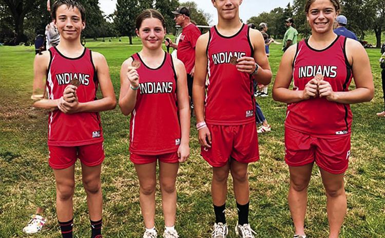 Pawnee City Cross Country Junior High Medal Winners (from left) Alex Hall, Lisa Holthus, Tim Hoffman and Alana Gyhra