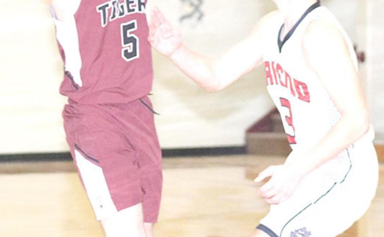 Paula Jasa/Republican LHS’ Mathew Barker makes a no-look pass last week