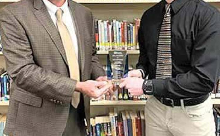 Pictured is Hayden receiving his award from Rick Kentfield-Superintendent of Lewiston Consolidated.