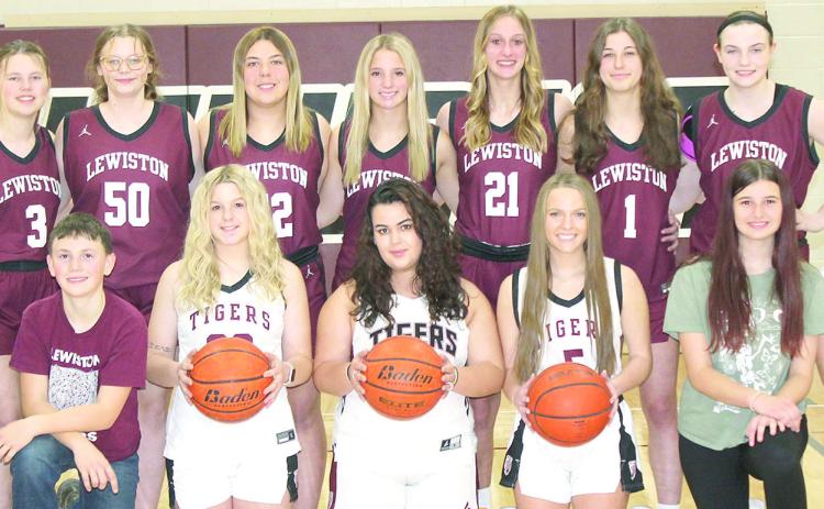 Members of the 2024-25 Lewiston Girls’ Basketball Team are from left: Corbin Crouse, s.m., Owen Wehrbein, s.m., DeLanye Currie, Natasha Ellis, Jenna Anderson, Brooklyn Eggert, s.m., Izzy Meyers, s.m. Back row: Ayden Hunzeker, Vivienne Johnsen, Bryleigh Crouse, Justice Currie, Maddie Janssen, Savannah Cutshall, Sara Wiles. Not pictured: Coaches Allison Nissen and Tracie Wehrbein.