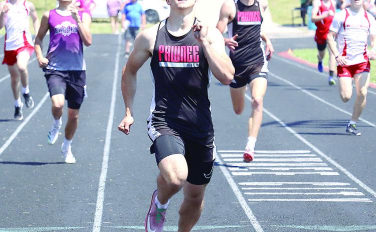 Pawnee City’s Jett Farwell (center) finishes hard in the Class D-1 boys’ 400 M. Dash while teammate Drew Menninga (right) finishes 2nd to qualify for State. Jasa/Republican