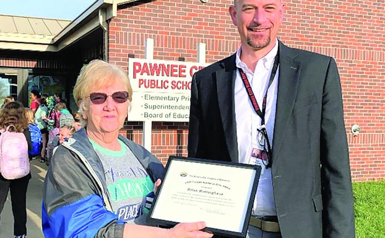 Chamber Vice-President, Lola Seitz, presents Brian Rottinghaus with the 2024 Carolyn VanHorne Civic Award