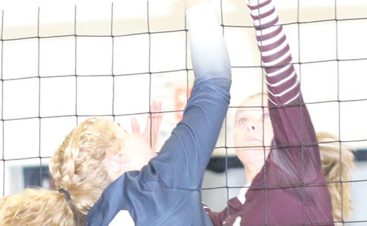HTRS’ Elie Bstandig (#2, left) and Lewiston’s Emma deKoning (#4, right) go up strong at the net. Paula Jasa/Republican