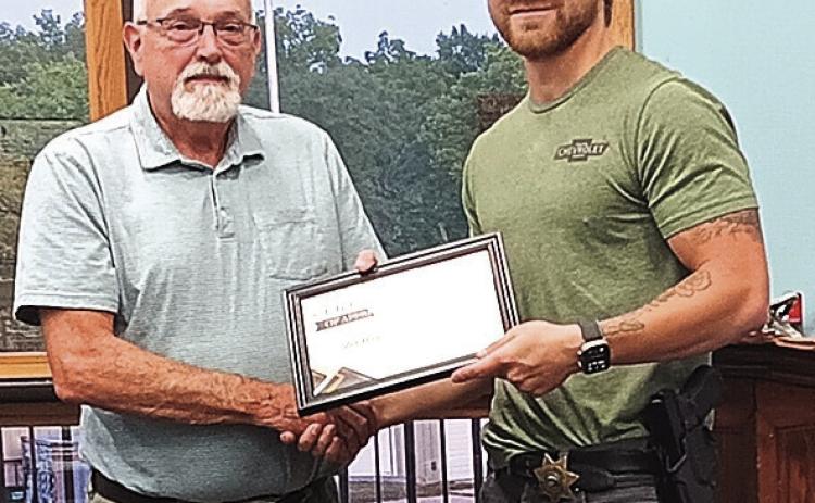 Mayor Hatfield hands Deputy Stankoski a Certificate of Appreciation photo by Reagan Connelly