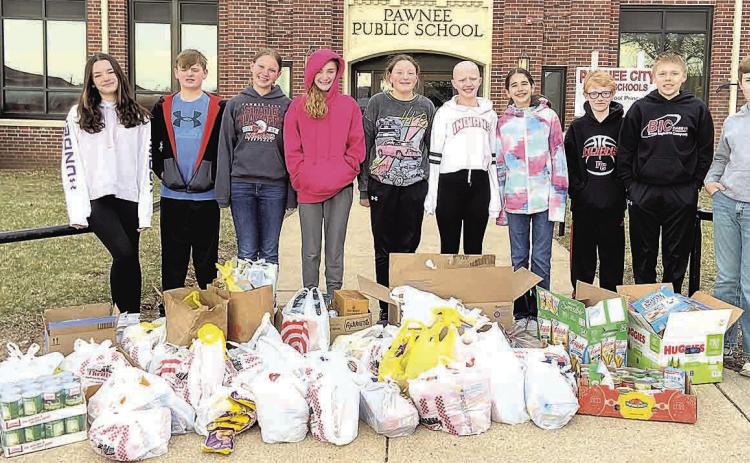 The Pawnee City Middle School Leadership Team collected over 600 items for donation to the SENCA food pantry. Pictured L to R: Ava Schlund, Isaac Rottinghaus, Ainsley Rauner, Aubrey Sisco, Amelia Strathman, Emma Turnbull, Sophia Sunneberg, Zeke Ferebee, Ryan Plager and Lane Johnson.