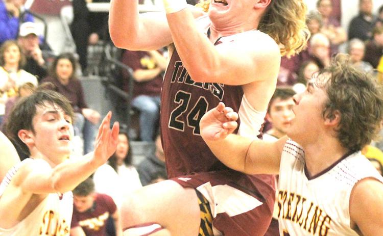 LHS’ Tristen Ray (#24) makes a strong move to the hoop against Sterling on Friday night. Ray scored 10 points against the Jets in their 47-61 loss. Paula Jasa/Republican
