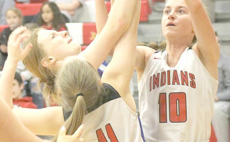 P.C.’s Cara Pierce (#11, left) and Emily Lytle (#10, right) go up for a rebound against Palmyra. Paula Jasa/Republican