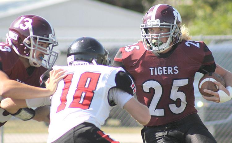LHS’ Tristen Ray (#25, right) waits for teammate Brady Bledsaw (#13, left) to block for him on one of his runs down the field. Ray led the Tigers with 213 yards rushing. Paula Jasa/Republican