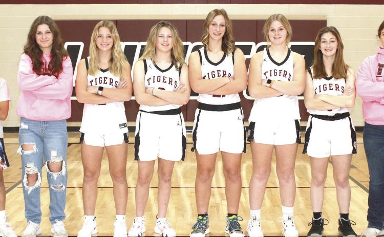 Members of the 2023-24 Lewiston Girls’ Basketball Team are from left: Braxten Eagleburger, s.m., Savannah Cutshall, s.m., Justice Currie, Ayden Hunzeker, Maddie Janssen, Delanye Currie, Kierstin Rehrs, Bryleigh Crouse, s.m. Not pictured: Sara Wiles, Head Coach Matt Sholty, Asst. Coach Kohlton Gabehart.