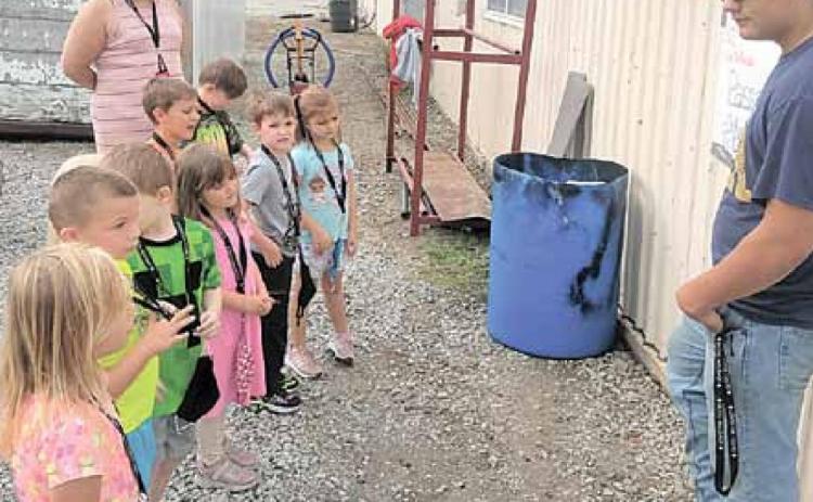 Above, Cayd Wilgers talks to the Kindergarten about ATV safety. Kindergarten (front to back) Peyton Keedy, Colton Brethouwer, Liam Cookus, Ellie Campbell, Nolan Janssen, Tristan Bombard, Sophia Meyer, Lelan Leitschuck, teacher Mrs. Tracie Wehrbein