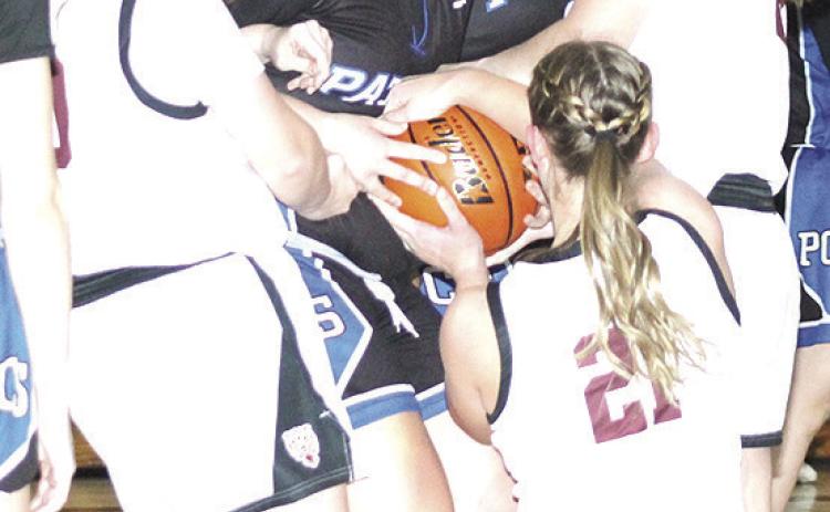 LHS’ Vivienne Johnsen (left), DeLanye Currie (right) and Maddie Janssen (#21, center) fight for a loose ball. Paula Jasa/Republican