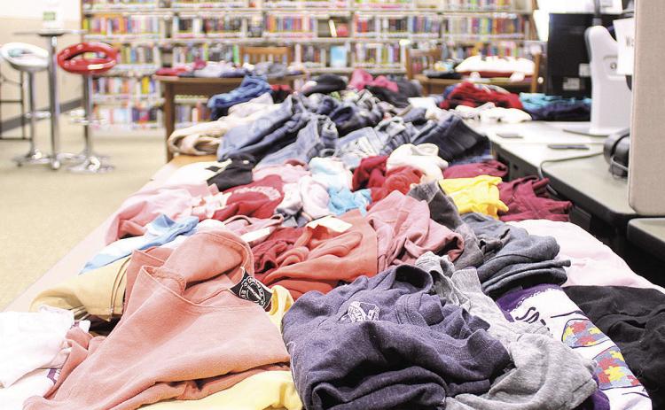 Library Hosts Free Clothing Giveaway and Henna Artist