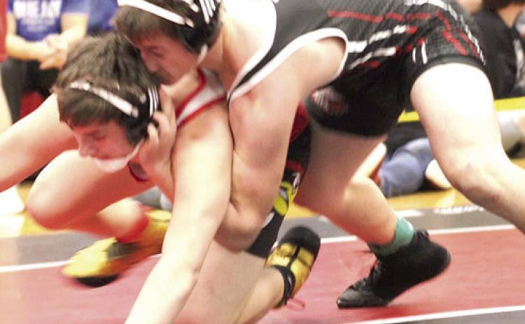P.C.’s Jesse McLaughlin (on top) takes on a wrestler in the 165 lb. division at Districts. Photo provided by Jamie Maloley