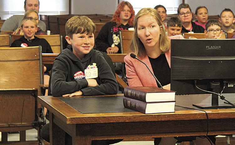 Pawnee County Attorney Emily Sisco consults with her cocounsel, an HTRS 5th grader