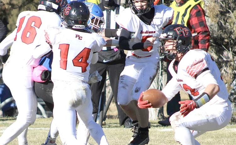 photo courtesy of Jamie Maloley P.C.’s Andy Maloley (#12, right) makes a move behind his blockers including Anthony Kling (#16, left, Jett Farwell #14 and Justin Pierce (#5). Maloley led the Indians with 22 carries for 167 yards and 4 TD’s.