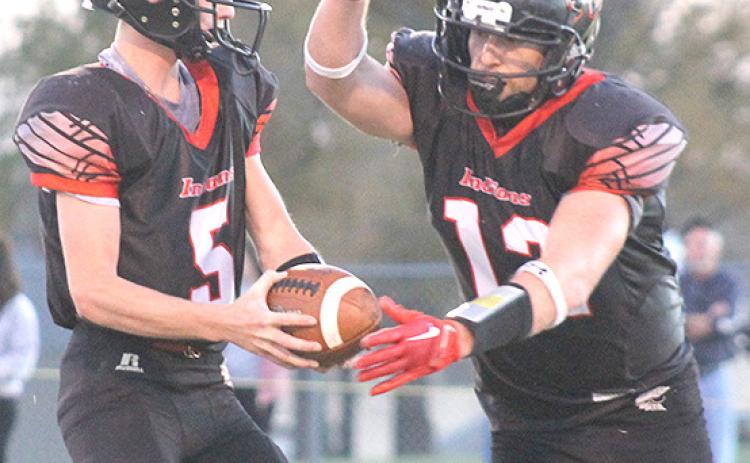 P.C.’s Justin Pierce (#5, left) fakes a handoff to Andy Maloley (#12, right) before throwing a TD pass. Paula Jasa/Republican