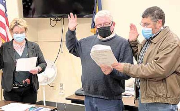 Pawnee City Clerk Tammy Curtis swears in new Council members Bruce Haughton and Donnie Fisher. Ray Kappel/Republican